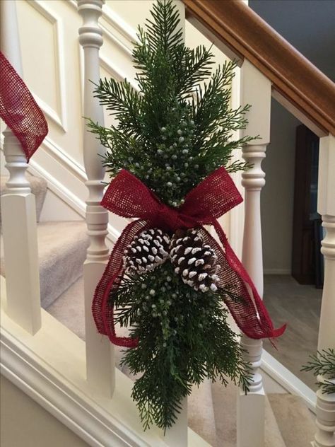 Diy Stair Christmas Decorations, Christmas Stair Swags, Christmas Spray Decoration, Christmas Stair Decoration, Rustic Red Christmas Decor, Christmas Decoration For Stairs, Cedar Christmas Decorations, Door Ribbon Christmas, Christmas Railing Decor