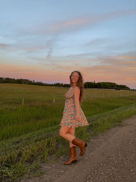 Summer dress, cowboy boots outfit, summer outfit inspo, field photoshoot Boots With Sundress, Dress And Brown Cowboy Boots Outfit, Sun Dress Cowboy Boots, Brown Cowboy Boots Dress Outfit, Sun Dress With Boots, Brown Country Boots Outfits, Summer Dress And Cowboy Boots, Brown Cowgirl Boots Outfit Summer, Dark Brown Cowboy Boots Outfit