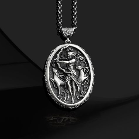 Greek Goddess Artemis 925 Sterling Silver Necklace, Greek Mythology Necklace, Roman Goddess of the Hunt Diana Locket, Special Gift for Her Artemis, one of the most important goddesses in the Greek pantheon, is the daughter of Zeus and Leto. She is Apollo's twin sister and goddess of the wilderness, hunting, archery, and the moon. FREY presents the "Artemis Necklace" for history and mythology lovers, inspired by the surviving depictions of Artemis, the goddess of pure light, and prepared with met Goddess Artemis, Goddess Of The Hunt, Roman Goddess, Special Gifts For Her, Jewelry Model, Greek Goddess, Silver Gifts, Metal Necklaces, Greek Mythology