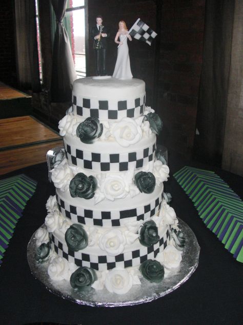 Only have the bride holding the trophy, the dress checkared, and my racecar at the bottom, have the whole thing checkared ad splattered with orange and greeen. Dream cake <3 Race Car Wedding Ideas, Race Theme Wedding Ideas, Racing Grooms Cake, Nascar Grooms Cake, Car Guy Wedding Cake, Checkered Flag Wedding, Car Themed Wedding, Sports Themed Wedding, Sports Wedding