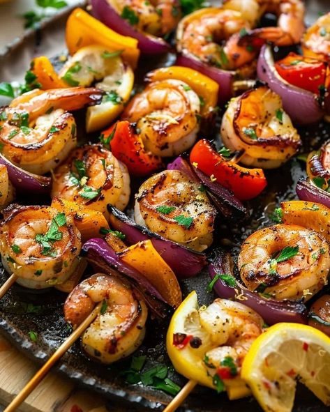 Grilling season is here! Kick it off with these mouth-watering Lemon Garlic Shrimp Skewers. Perfect for your next BBQ! Visit website for full recipe at https://northeastnosh.com/f/lemon-garlic-shrimp-skewers #northeastnosh #grilledshrimp #lemon #garlic #skewers #healthydinner #summercooking #grillseason #shrimpskewers #vegetableskewers #easyrecipes #weeknightdinner #seafoodrecipes #paleofriendly #glutenfree #dinnerideas #cookingathome #grilling #flavorful #homemade #freshingredients Shrimp Bbq Recipes Skewers, Shrimp Skewers Grill, Garlic Shrimp Skewers, Bbq Shrimp Skewers, Crunchy Food, Shrimp Marinade, Grilled Shrimp Skewers, Vegetable Skewers, Lemon Garlic Shrimp