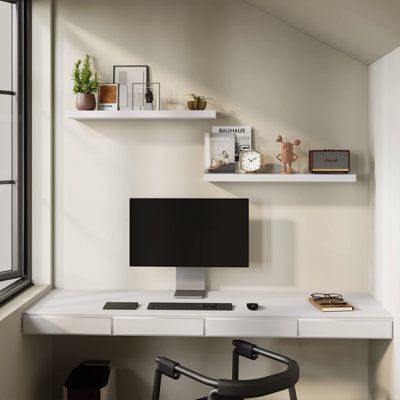 The Bameos Wall Shelf will maximize space without taking up any square feet - each board measures 31.5” L x 7.7” W x 1.5” H. Reduce clutter and highlight decor in a compact space - giving the illusion of more space in your studio apartment, dorm room or small living area and so on | Latitude Run® Wall Mounted Wooden Shelves w/ Invisible Brackets Set of 2 White 1.5 x 31.5 x 7.68 in | Home Decor | C110211969 | Wayfair Canada Desk Wall Shelves, Floating Shelves Study, Floating Shelf Wall Ideas, Wall Shelves Above Desk, Shelf Over Desk, Aesthetic Floating Shelves, Shelf Above Desk, Wall Shelf Arrangement, Shelves Above Desk