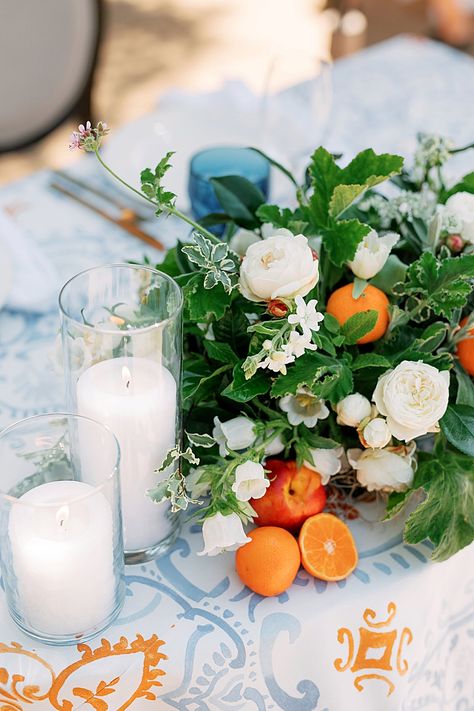 Dusty Blue And Citrus Wedding, Orange Citrus Wedding Decor, Citrus Tablescape Wedding, Summer Citrus Wedding Decor, Citrus Colored Wedding Flowers, Light Blue And Citrus Wedding, Mediterranean Tablescape, Citrus Floral Centerpiece, Mint Wedding Cake