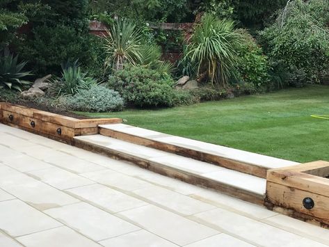 Large porcelain patio, oak sleeper retaining walls and new lawn in Sutton - Modern - Garden - Surrey - by Ayegardening Ltd | Houzz Oak Sleepers Retaining Wall, Sleepers Retaining Wall, Lawn Retaining Wall, Curved Sleeper Wall, Patio And Sleepers, Oak Sleeper Retaining Wall, Sleeper Wall Garden, Sleeper Steps Garden, Porcelain Patio