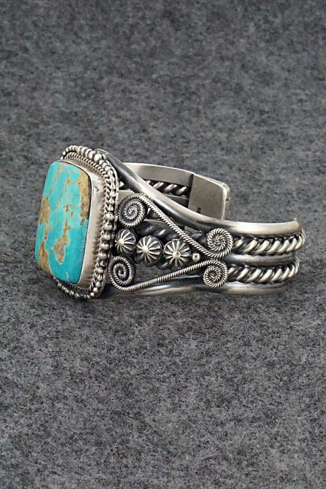 This beautiful and substantial Royston turquoise and sterling silver bracelet was made by Navajo silversmith Michael Calladitto. The back is signed M&R Calladitto, Navajo and stamped .925.Size: 5 1/2" (will fit up to a 6 7/8" wrist)Gap: 1 3/8"Width: 1 1/2"Free shipping on all orders! We ship with USPS and always include tracking. All orders ship within a day of payment.Returns are accepted up to 30 days after you receive your order. Just send us a message. Our shop offers cash back or store cred Santa Fe Jewelry, Native American Jewellery, Navajo Turquoise, Royston Turquoise, Stacked Jewelry, Cuff Bangles, Leather Cuffs, Native American Jewelry, Turquoise Sterling Silver