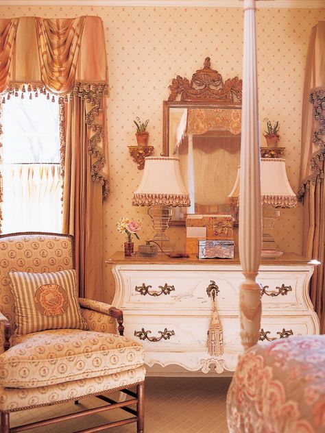 An antique chair sits in front of a dresser with two lamps in this Victorian bedroom. Antique Bedroom Decor Ideas, Peach Cottage, Charles Faudree, Tree Orchard, Peach Bedroom, Victorian Room, 80s Room, Valley Cottage, Spring Court