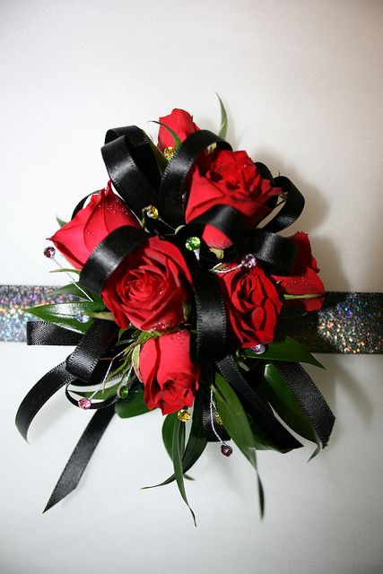 Corsage Red And Black, Red Spray Rose, Red Corsages, Rose Wrist Corsage, Orchid Corsages, Homecoming Flowers, Poinsettia Care, Prom Corsage And Boutonniere, Hoco Ideas