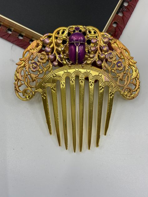 Gold plated large decorative hair comb Unique Hair comb Gorgeous Egyptian Scarab Reversible to gold on opposite side no scarab. Lovely birds adorn this with tiny accents of violet enamel. Unique, large scroll gorgeous hair ornament. Large piece of about 3-1/2 inches by 3-1/2 inches. Hand crafted for the sophisticate in mind. What a statement by Myelegantthings USA Egyptian Hairstyles, Art Deco Inspired Jewelry, Bridal Hair Ornaments, Aesthetic Wear, Antique Hair Combs, Decorative Hair Clips, Decorative Hair Combs, Japanese Jewelry, Egyptian Scarab