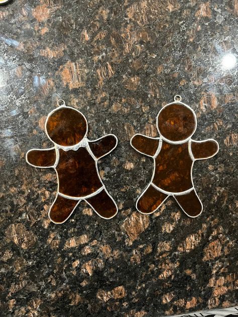 Handmade stained glass Gingerbread Man! These are very cute holiday decorations or ornaments. Additional colors and customizations are available upon request! Stained Glass Gingerbread Man, Stained Glass Candy Cane, Easy Stained Glass Christmas Ornaments, Stained Glass Art Christmas, Stain Glass Christmas Ornament Patterns, Stained Glass Christmas Tree Ornaments, Stained Glass Ornaments Christmas, Christmas Stained Glass Ideas, Stained Glass Gingerbread