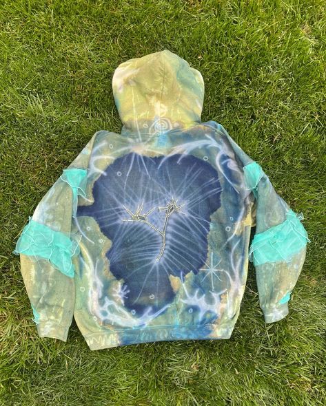 SUMMER'S DAZE HOODIE custom hoodie featuring: 🪷bleached designs 🪷airbrushed designs 🪷hand-sewed on spiral and blue ruffles on sleeves 🪷 cyanotypes of grasses and mystery plant 🪷 embroidery 🪷 custom label patch 🪷 beaded hoodie strings hand wash in cold water. this hoodie is amazing!!!! my fav 🫶🫶🫶 #customclothing #upcycle #custom #hoodie #airbrushing #bleached #clothing #embroidery #cyanotype #ethereal #unique Upcycled Streetwear, Bleached Clothing, Airbrush Clothes, Venus In Libra, Plant Embroidery, Clothing Embroidery, Cartoon Style Drawing, Custom Hoodie, Airbrush Art