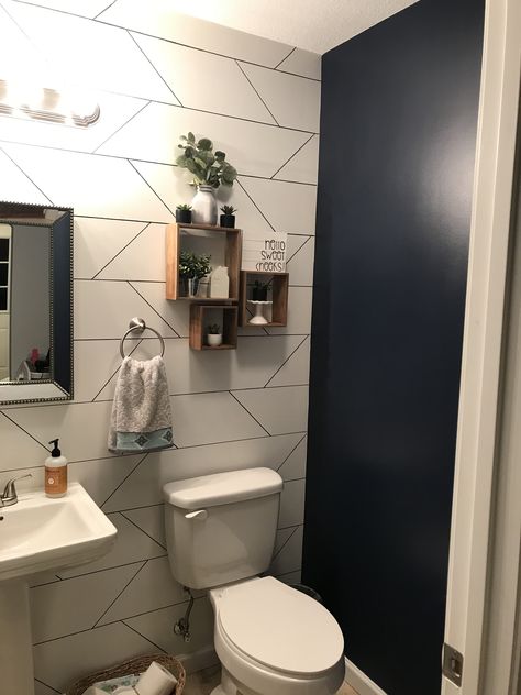 Half bath with accent wall and navy paint Half Bathroom Accent Wall, Bathroom Wall Ideas, Bedroom Wallpaper Accent Wall, Wall Bedroom Diy, Wallpaper Accent Wall Bathroom, Small Half Bathroom, Navy Accent Walls, Grey Accent Wall, Black Accent Walls