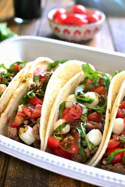 Caprese Tacos combine the classic flavors of caprese salad with a go-to family favorite - tacos! These tacos are made with Italian seasoning and make an easy, delicious weeknight meal your family will love! Recipes Quesadillas, Crockpot Beef Tacos, Pork Tacos Crockpot, Tasty Tacos Recipe, Italian Beef Sandwich, Taco Tuesday Recipes, Easy Meal Plan, Slow Cooker Salsa Chicken, Lime Chicken Tacos