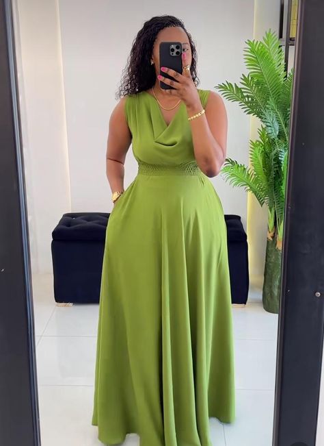 This stunning Green Sleeveless Maxi Dress, designed for both comfort and elegance. Crafted with a soft, lightweight fabric, this dress features a beautiful draped neckline that adds a touch of sophistication to your look.   Whether you're attending a special event, enjoying a casual day out, or simply looking for a stylish outfit for a summer gathering, this maxi dress is your go-to choice. This dress is made to order, ensuring that each piece is crafted with the utmost attention to detail and q Cute Simple Dresses, Beautiful Maxi Dresses, Draped Neckline, Fashion Dresses Online, Flowing Skirt, Maxi Robes, Italian Wedding, Sleeveless Maxi Dress, Cinched Waist