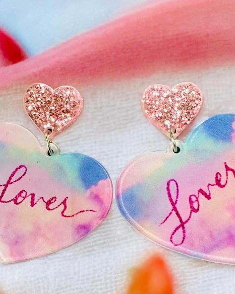 $14 LOVER ERA Earrings Get ready to make a statement with the stunning Lover Era Earrings! 2” long 1.5” in diameter Acrylic Order yours here⬇️ https://tealtigershop.com/products/lover-era-earrings?utm_content=ios&utm_medium=product-links&utm_source=copyToPasteboard 📦Ships from MS, next business day, or pick up in store at 767 Church St, Lucedale, MS. 🛍️ #loverera #earrings #boutique #boutiqueshopping #shopsmall Lover Era, Business Day, Boutique Shop, Small Shop, Get Ready, Ios, Pick Up, In Store, Ships