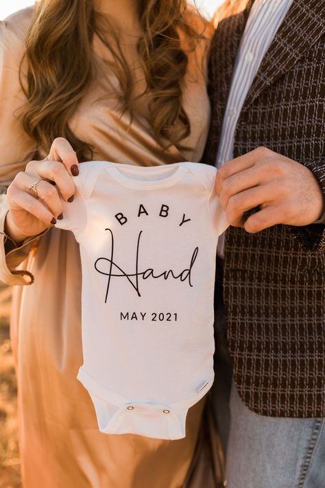 Fun Bump Photos, Pregnant Announcement Photos, Onesie Ideas Announcement, Onsie Pregnant Announcement, Maternity Photos With Onesie, Were Pregnant Announcement Ideas, Baby Reveal Photoshoot Ideas, Moody Pregnancy Announcement, Pregnancy Photo Announcement