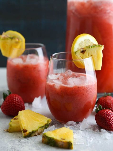 A family-friendly punch made with strawberries, lemons, and pineapple juice! Strawberry Pineapple Punch, Strawberry Punch Recipes, Frozen Limeade, Pineapple Punch, Pineapple Strawberry, Spiced Apple Cider, Juicing For Health, Punch Recipes, Fruit Drinks