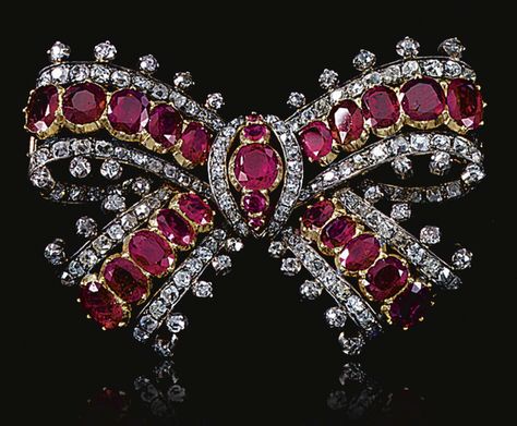 RUBY AND DIAMOND BOW BROOCH, MID 19TH CENTURY.  Designed as a ribbon tied bow set with graduated lines of oval rubies mounted in cut-down collets bordered with lines of old-mine and circular-cut diamonds. Diamond Bows, Bow Brooch, Family Jewels, Bow Jewelry, Diamond Brooch, Royal Jewels, Ruby Jewelry, Bow Set, Royal Jewelry