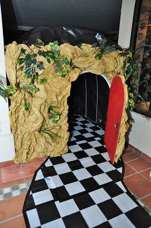 The rabbit's hole tunnel exit. Tunnel was 40 feet long, pvc & wood frame with black plastic sheeting. Alice In Wonderland Escape Room Ideas, Alice In Wonderland Hallway Decorations, Down The Rabbit Hole Decorations, Alice And Wonderland Decor, Mad Hatters Tea Party Ideas, Mad Hatter Decorations, Alice In Wonderland Escape Room, Alice In Wonderland Tunnel, Alice And Wonderland Party