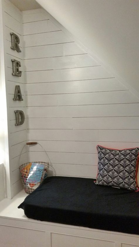 Reading nook with shiplap. Perfect for our awkward,  sloped wall space. Storage Decor Ideas, Sloped Wall, Ideas Under Stairs, Bed Under Stairs, Relaxation Corner, Under Stairs Nook, Space Under The Stairs, Stair Nook, Homeschool Room Design