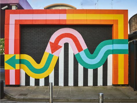 A Tour Of The World’s Coolest Supergraphics This Must Be The Place Mural, Wall Branding Ideas, Geometric Mural, Colorful Graphic Design, School Murals, Pintura Exterior, Environmental Graphic Design, Tech Art, Artist Collective