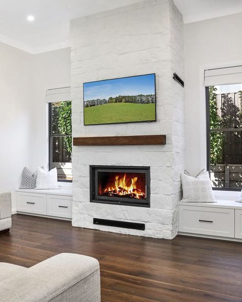 This beautiful Mt Blanc 970 wood fireplace is seamlessly integrated into a modern white brick feature wall, enhancing the charm of this lovely Bowral home in the Southern Highlands.  #fireplacegoals #fireplace #fireplaceinsert #woodfireplace #sustainableheating #maisonfireplace #interiordesign #maisonfireplaces #australianhome Electric Fireplace Between Windows, Fireplace Between Windows, Mt Blanc, Brick Feature Wall, White Fireplace, Wood Fireplace, White Brick, Fireplace Inserts, Small Wall