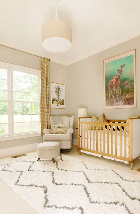 This is a refreshing take on a safari theme for a nursery, and I love it! Rather than plastering the walls with cartoon decals, these parents went for a fun and colorful print that brings some life into the room. The curtains also give a nod to the theme while tying the colors together, and the mix of beiges and taupes is a real win! Safari Nursery Room, Boy Rug, Boy Rugs, Neutral Nursery Colors, Gender Neutral Nursery Colors, Boy Nursery Design, Modern Baby Nursery, Baby Nursery Design, Baby Room Colors