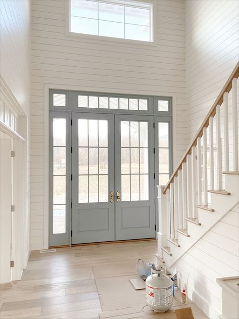 Today, I'm sharing our Cambek front doors being installed! This is exactly what I had envisioned, and it turned out beautifully! Double Front Doors Ranch House, Blue Door With Sidelights, Front Door Colors Interior Entryway, Cape Blue Benjamin Moore, Front Door Circle Window, Blue Front Door Interior, Nina Williams Blog, Double Door Entryway Interior Foyers, Blue Interior Front Door