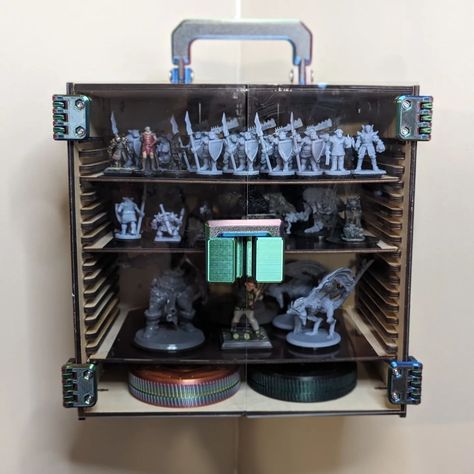 Planning a massive tabletop battle??? Mini storage, display, and carrier case! 🐉😈👺👹🤖🙀🧚🧞🧝🧙🧛🧟🧌 Each shelf can store up to 88 medium size minis! Comes with 4 shelves with a magnetic base to lock the minis onto. It also has optional cleats for storing on the wall. This current version is designed to hang in the corner, but a flat version will be released soon! *Assembly required* #tabletopgames #d&d #dnd #warhammer #warhammercommunity #dndminiatures #miniature #dnd5e #dndminis #dndminiatu... Dnd Warhammer, Dnd Crafts, Dnd Minis, Corner Display, Miniature Display, Dnd Miniatures, Mini Storage, Mini Accessories, Storage Display