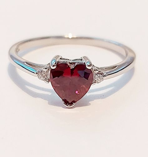 VALENTINES GIFT STERLING SILVER HEART ENGAGEMENT RING GARNET HEART  Face Height: 7 mm Band Width: 2 mm Stone: Garnet / Clear CZ post out in a free little gift box  nb;  Garnet is synthetic but very beautiful Valentines Promise Ring, Red Heart Ring, White Gold Ruby Ring, Ruby Heart Ring, Silver Promise Rings, Heart Engagement, Garnet Ring Silver, Garnet Heart, Dark Jewelry