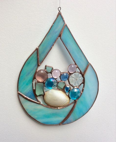 Beautiful stained glass teardrop made from iridescent turquoise glass with sea glass, shell, glass pebbles and a chandelier crystal. Stained Glass With Crystals, Teardrop Stained Glass Patterns, Easy Stained Glass Patterns, Copper Foiling, Light Posts, Stained Glass Window Clings, Suncatcher Diy, Glass Art Products, Stained Glass Gifts