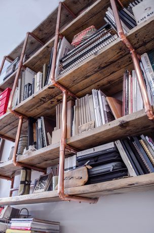 Copper Pipe And Reclaimed Wood Shelving - Steel Roots Design Copper Shelving, Cozy Cabin Bedroom, Pole Barn Loft Ideas, Victorian Bohemian Decor, Commercial Shelving, Fall Dining Room Table, Roots Design, Living Room Ideas On A Budget, Room Ideas On A Budget