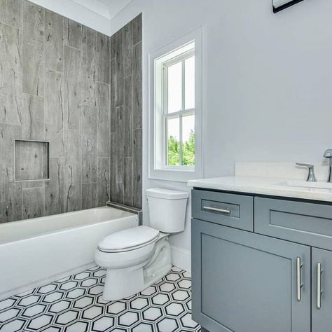 Wood look tile tub surround and a hexagon porcelain tile floor Tub Surround Ideas, Tile Tub Surround, Bathtub Surround, Pebble Floor, Bathtub Tile, Marble Showers, Bathroom Tile Ideas, Tub Surround, Herringbone Floor