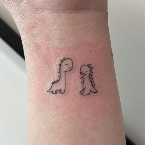 Small Cartoon Dinosaur Tattoo, Dinosaur Friend Tattoo, Line Work Dinosaur Tattoo, Trex Cute Tattoo, Cute Dinosaur Tattoo Ideas, Cute Trex Tattoo Ideas, Dinosaur Small Tattoo, Mom And Son Dinosaur Tattoo, T Rex Tattoo Small