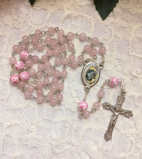 Handmade St. Rita of Cascia rosary beads made with 6mm pink Rose Quartz beads and 8mm ceramic pink & white floral beads. The center and crucifix are both made in Italy. Pink Rosary Aesthetic, Rosary Aesthetic, Rita Of Cascia, Pink Rosary, Flower Rosary, Saint Rita, St Rita Of Cascia, Church Aesthetic, Soft Pink Theme