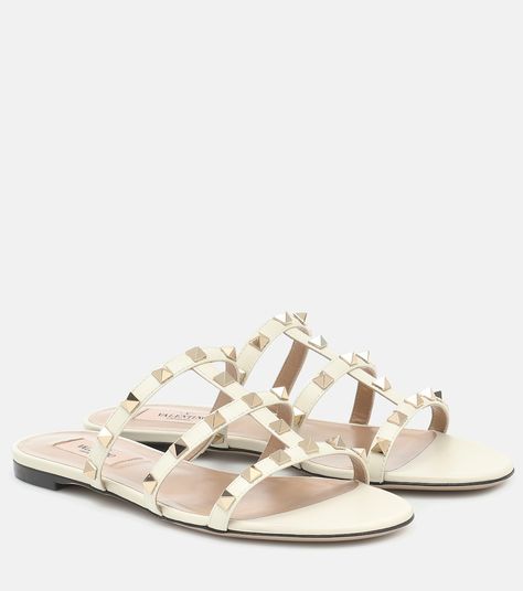 Rockstud Leather Slides in White - Valentino Garavani | Mytheresa Valentino Slides, Spring Sunglasses, Vacation 2023, Patent Leather Ballet Flats, Valentino Garavani Shoes, Spring Vacation, White Shoes Women, Valentino Rockstud, Studded Sandals