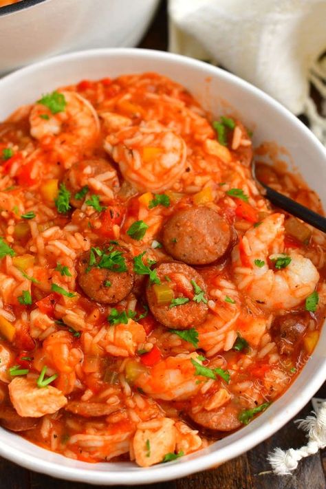 Jambalaya is a classic spicy New Orleans dish loaded with sausage, chicken, and shrimp. This hearty and meaty dish is made in one pot with rice, the holy trinity of vegetables, Cajun spices, hot sauce, and tomato broth. #jambalaya #rice #dinner #chicken #sausage #andouille #shrimp #onepot #creole #cajun Authentic Creole Jambalaya Recipe, Ham Dinners, Creole Jambalaya Recipe, Jambalaya Rice, Shrimp Jambalaya, Cajun Spices, Jambalaya Recipe Easy, Jambalaya Recipe, Tomato Broth