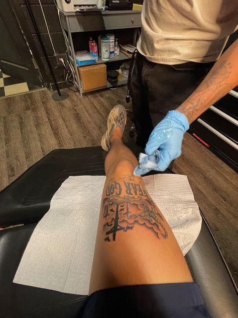 Leg Tattoo Ideas For Men Calves, Fear God Tattoo Men Leg, Rare Tattoos Men Leg, Hamstring Tattoo For Men, Thigh Tattoos Men Ideas, Men Calf Tattoo, Men Thigh Tattoos, Men Thigh Tattoo, Above Knee Tattoo Men