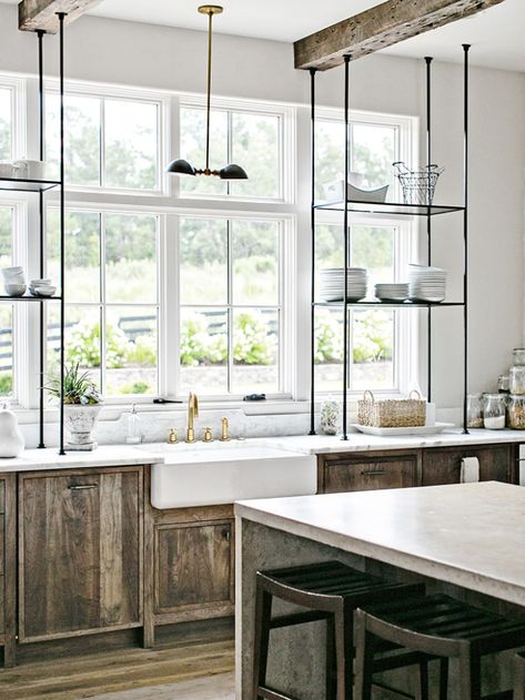 Here’s a Bright Storage Idea: Extend Your Open Shelving Across the Kitchen Windows Industrial Farmhouse Kitchen, Bistro Shelving, Bungalow Kitchen, Window Shelves, Rustic Kitchen Cabinets, Kitchen Open, Open Kitchen Shelves, Bright Kitchens, Kitchen Window