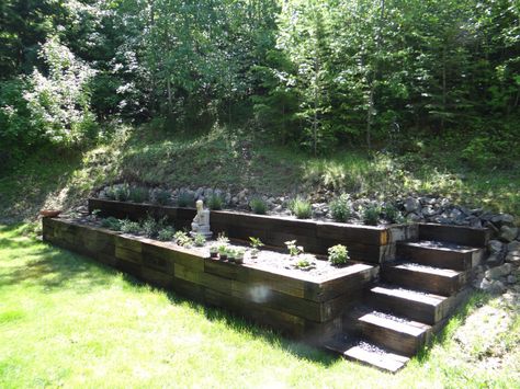 Railroad tie raised garden. Two tiers with stairs on each side! Landscape Ideas With Railroad Ties, Cross Ties Landscaping, Tiered Landscaping, Tiered Gardens, Tiered Backyard, Railroad Ties Landscaping, Railroad Tie Retaining Wall, Tiered Landscape, Garden Education