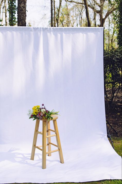 Spring photoshoot setup white backdrop with wooden stool Backdrop Photoshoot Poses, Joyful Photoshoot, Spring Photo Shoot Ideas, Spring Photo Shoot, Spring Minis, Picture Props, Photography Mini Sessions, Photo Shoot Ideas, Naeem Khan