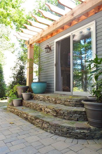 LOVE LOVE this back porch/steps/patio. love the materials and shape of the steps (maybe limestone? could my father-in-law do this? i think so...) love the arbor, love the  brick patio. would want french doors instead of a slider. Farmhouse Front Porch Decor, Patio Stairs, Front Porch Steps, Patio Layout, Brick Patio, Patio Steps, Building A Porch, Stone Steps, Farmhouse Front Porches