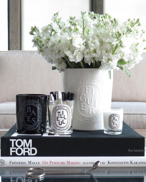 coffee table styling, diptyque candles, tom ford book, #interior #inspo Tom Ford Book Decor Coffee Table Styling, Tom Ford Coffee Table Book, Coffee Table Book Styling, Diptyque Candles Decor, Tom Ford Book, Diptyque Decor, Elegant Table Decorations, Diptyque Candles, Antique Brass Chandelier