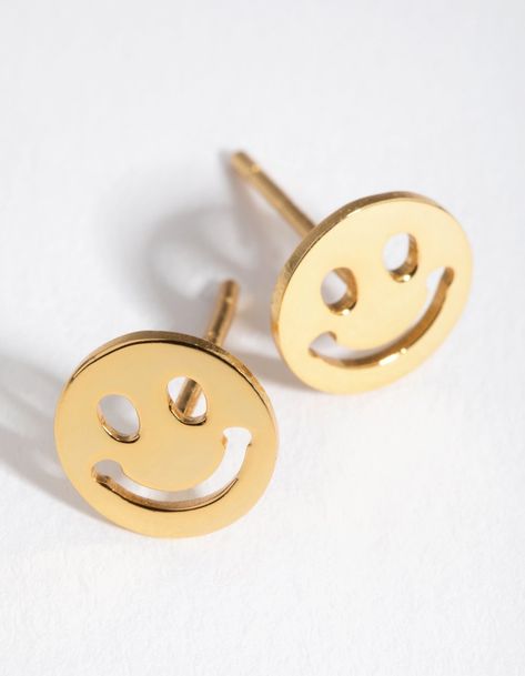 Description Spoil yourself with sterling silver jewellery. These stud earrings are gold plated and shaped like funky smiley faces. A must have for any collection, sterling silver jewellery is both reliable and fashionable.  Size: 7mm (L) x 7mm (W) Weight:  0.35g (single earring) Face Earrings, Dainty Studs, Smiley Faces, Sterling Silver Jewellery, Spoil Yourself, Single Earring, Happy Face, Favorite Rings, Daily Look