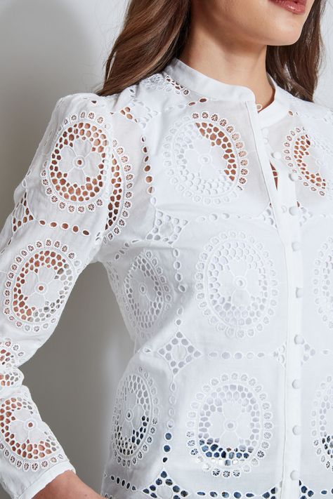 In a modern geometric lace, this shirt has a cool vibe that will work in your wardrobe from Spring to Fall. The self-covered button front closure, band collar & open-work lace make it perfect for wearing day to night. Ultra-Versatile & chic, wear it as a shirt or a jacket with Elie 's favorite white or indigo jeans, or dressed up with our fluid crepe pants. Elie Tahari Exclusive Lace Button Down Shirt 63% Polyester, 37% Cotton Runs true to size. Model is 5'9" and wearing size S Length From Shoul Corporate Tops, Cotton Tops For Jeans, Lace Top Design, Crepe Pants, Lace Weave, Women Blouses Fashion, Geometric Lace, Indigo Jeans, Lace Button