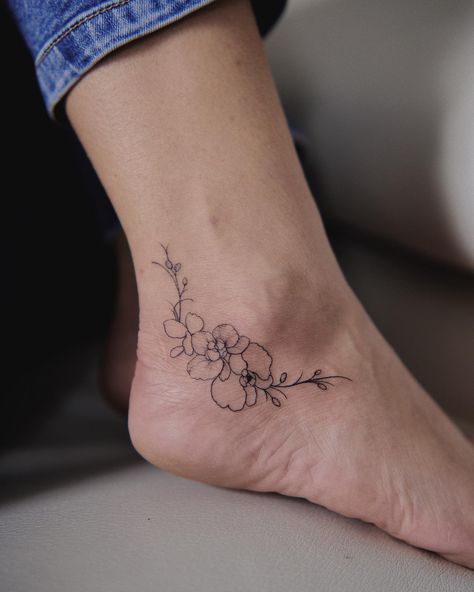 25 Prettiest Orchid Tattoo - Small Tattoos & Ideas Orchid Tattoo Ankle, Delicate Orchid Tattoo, White Orchid Tattoo, Orchid Tattoo Minimalist, Orchid Outline, Tattoo Orchid, Orchid Tattoo Design, Orchid Tattoo Meaning, Orchid Tattoos