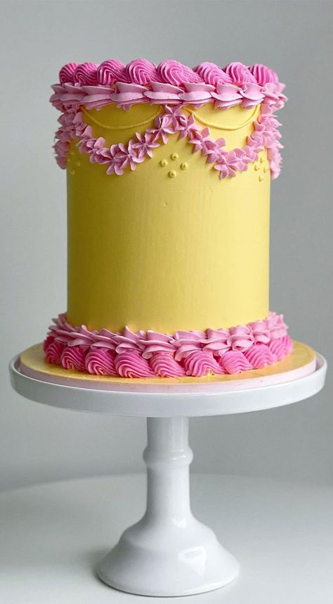 12. Pink and Yellow Buttercream Buttercream frosting is probably one of the most popular cake decorating. It is pretty, fluffy, good-looking and tastes great... Round Cake Piping Ideas, Simple Lambeth Cake, Lambeth Cupcakes, Lambeth Style Cakes, Red And Yellow Cake, Vintage Buttercream Cake, Lambeth Cakes, Retro Cakes, Lambeth Cake