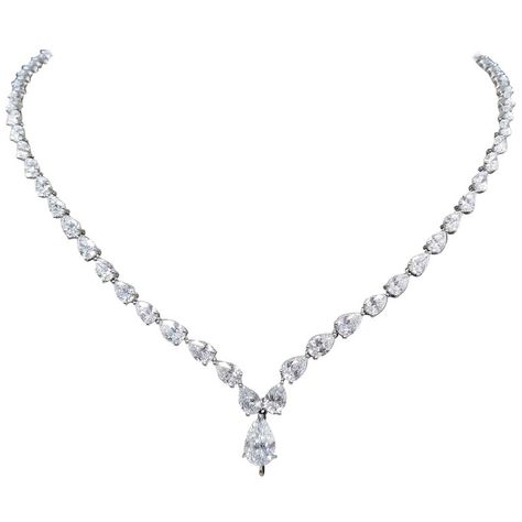 Scarselli is featuring a Platinum 22.22 carat Pear Cut Diamond Tennis Necklace. Total of 68 diamonds color graded D-E-F, and clarity VVS-SI encountered into a front drop pear cut diamond 1.08ct GIA certificate 5146770762 (see certificate picture for detailed stone information). The inside length of the necklace is 16" and can be worn without or with any additional pendant acquisition, using the hidden hook that securely grabs any sized pendant like this breathtaking Scarselli 8 carat Fancy Vivid Diamond Teardrop Necklace, Pear Shaped Necklace, Teardrop Diamond Necklace, Fancy Necklaces, Vintage Diamond Necklace, Diamond Necklace Wedding, Drop Necklaces, Luxury Exterior, Diamond Drop Necklace