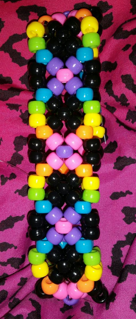 Psychedelic rainbow DNA kandi cuff Rave Cuffs Kandi, X Cuff Kandi, Cool Kandi Patterns, Cuff Ideas Kandi, Ladder Cuff Kandi Pattern, Kandi Bracelets Patterns How To Make, Kandi Shoe Laces, Kandi Cuff Ideas Tutorial, Kandi Cuff Ideas Easy