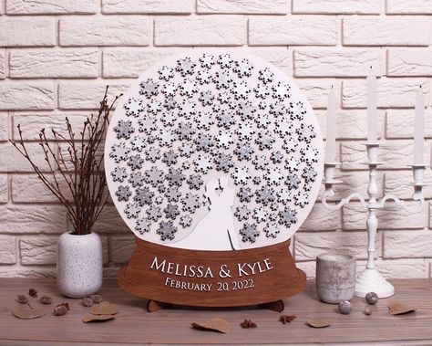 "Snow Globe with Snowflakes 3D wedding guest book alternative CUSTOM ORDER Winter wedding guestbook Unique Christmas gift Custom wedding sign This 3d wedding guestbook, a snowflakes guest book alternative that is fun for you and your guest. Your guests sign the snowflakes and then you can actually put this wall art into a frame and hang it in your home to enjoy for years to come. You will always remember who shared in your wedding day with you and spouse. We are happy to customize the colors of Winter Wonderland Wedding Theme, Wonderland Wedding Theme, Memorable Wedding Gifts, Wedding Tree Guest Book, Snowflake Wedding, Rustic Winter Wedding, Wedding Guest Book Unique, Winter Wedding Guests, Wedding Guest Books