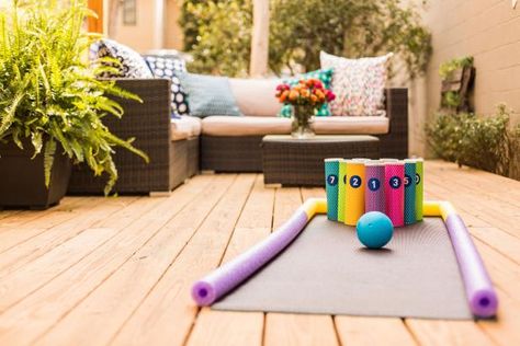 Use a yoga mat, pool noodles and chip cans to create a fun and colorful backyard bowling alley. Diy Bowling Alley, Backyard Bowling, Kids Outdoor Games, Diy Bowling, Dunk Tank, Outdoor Games For Kids, Baby Food Jars, Diy Bricolage, Kid Pool